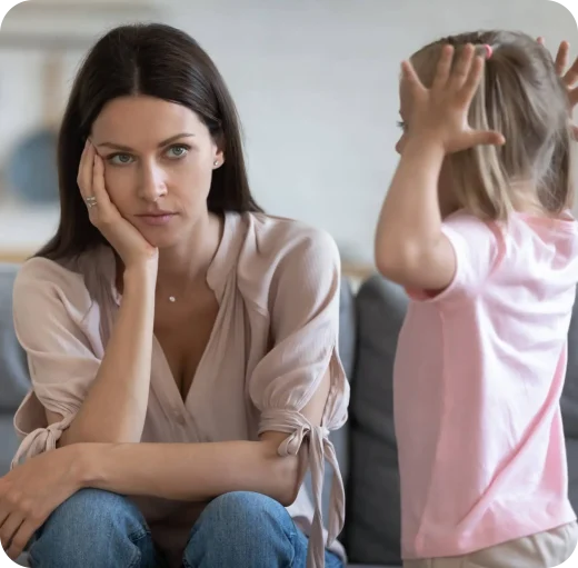 young mother feeling exhausted while being with her baby working home 1 2